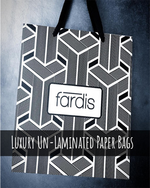 Luxury un-laminated gift bags with ribbon handles